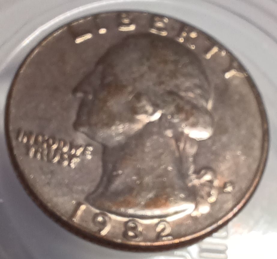 1982-Quarter-With-Copper-Showing-Through-Face.-Cladding-Error?